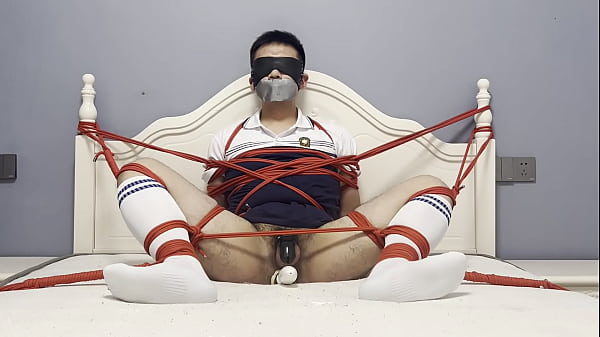 Asian boy tied to the bed, plugged by dildo and struggled