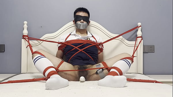 Asian boy tied to the bed, plugged by dildo and vibrated to cum