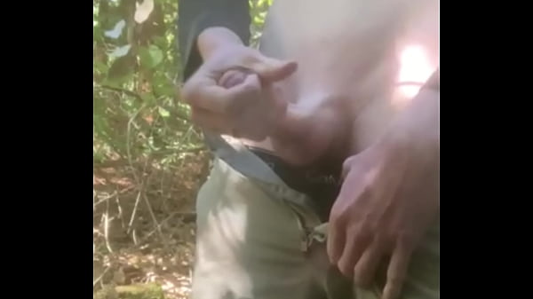 Fit man jerks off on a public hiking trail